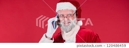 Portrait of Santa Claus Talking on Smartphone Smiling 120486459