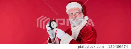Portrait of Santa Claus Holding Clock and Pointing 120486474