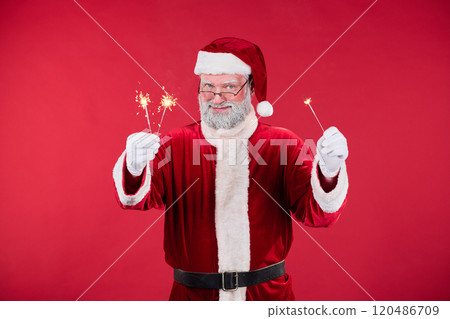 Santa Claus Holding Sparklers in Festive Holiday Setting 120486709