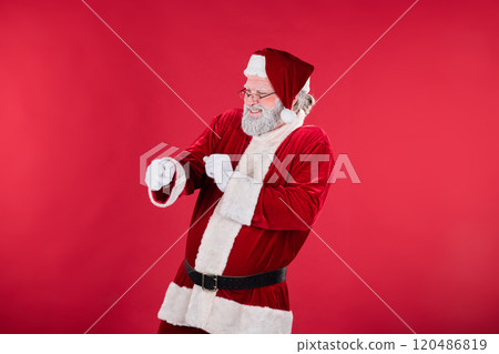 Laughing Santa Claus Pointing Against Red Background Laughing Santa Claus Pointing Against Red Background 120486819