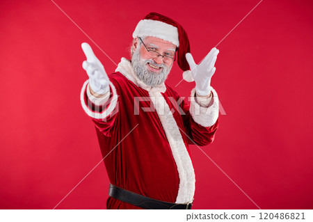 Smiling Santa Claus Pointing at Camera in Festive Setting 120486821