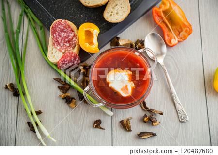 Lenten borscht with dried mushrooms and vegetables, on a light wooden table Lenten borscht with dried mushrooms and vegetables, on a light wooden table 120487680