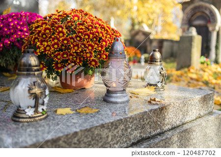 Decorated graves at a cemetery on All Saints Day (Wszystkich Swietych) in Poland. Decorated graves at a cemetery on All Saints Day (Wszystkich Swietych) in Poland. 120487702