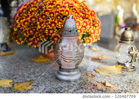 Decorated graves at a cemetery on All Saints Day (Wszystkich Swietych) in Poland. Decorated graves at a cemetery on All Saints Day (Wszystkich Swietych) in Poland. 120487709