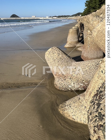 Tetrapods sinking into the sand Tetrapods sinking into the sand 120487834