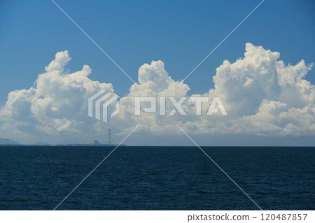 Summer cumulonimbus clouds developing over the ocean 120487857