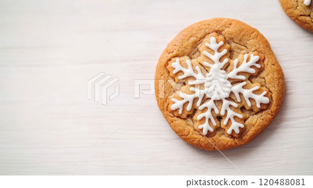 Decorative snowflake cookie on a wooden table, perfect for winter festivities. 120488081