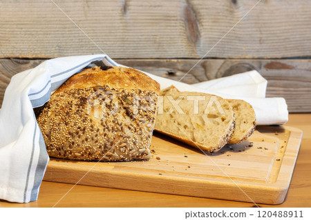 Homemade bread, sourdough wheat loaf with seeds 120488911