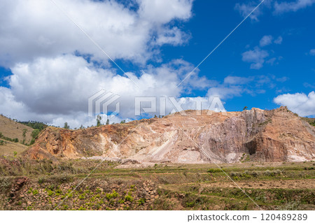 Natural Rock Formation with Exposed Geology Layers Under Blue Sky in Madagascar. Natural Rock Formation with Exposed Geology Layers Under Blue Sky in Madagascar. 120489289