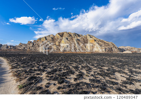 Burnt Landscape with Rocky Formations in Isalo National Park, Madagascar. 120489347