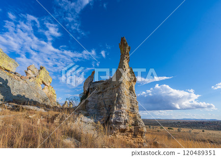 Monster-shaped Rock Formation Against Blue Sky at Isalo National Park. Monster-shaped Rock Formation Against Blue Sky at Isalo National Park. 120489351