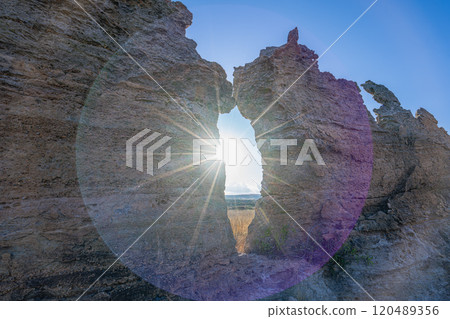 Sunset Through Natural Rock Window in Isalo National Park, Madagascar. 120489356
