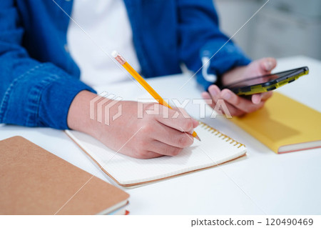 Teenage using smart phone for communication, search data internet website to learn. Teenage using smart phone for communication, search data internet website to learn. 120490469
