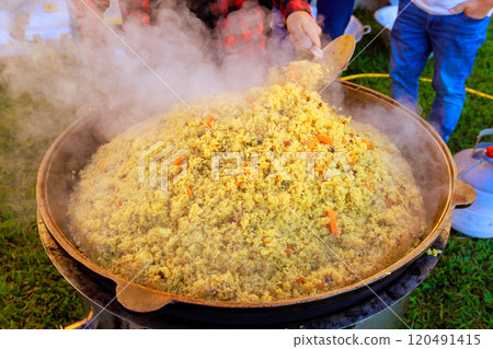 It is traditional Turkish pilaf to be cooked in large cast iron cauldron 120491415
