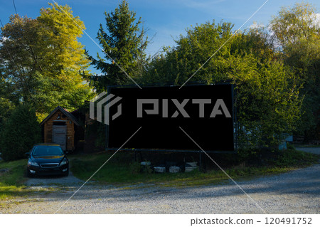 Background for design. Advertising billboard along the road in the city on a autumn sunny day Background for design. Advertising billboard along the road in the city on a autumn sunny day 120491752