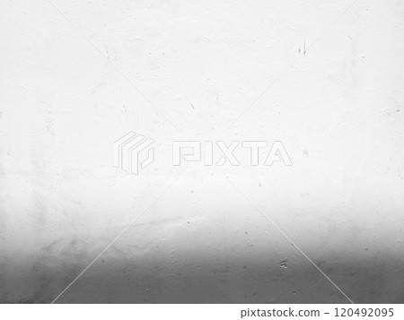 White grunge concrete wall background with light beam on surface and shadow at the bottom. 120492095
