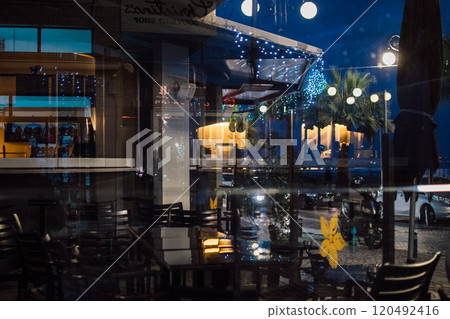 the night streets of Larnaca, Cyprus are decorated for the New Year and Christmas 120492416