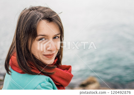 portrait of a young woman in bright clothes on the rocky coast of Ayia Napa, Cyprus portrait of a young woman in bright clothes on the rocky coast of Ayia Napa, Cyprus 120492876