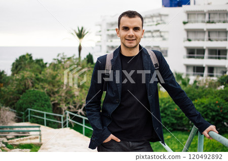 a young man next to hotels in the resort town of Ayia Napa, Cyprus a young man next to hotels in the resort town of Ayia Napa, Cyprus 120492892