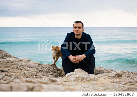 a young man on rocky coast with turquoise water of Ayia Napa, Cyprus a young man on rocky coast with turquoise water of Ayia Napa, Cyprus 120492908