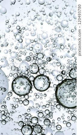 Macro Shot of Moving Oil Bubbles on Light Background Macro Shot of Moving Oil Bubbles on Light Background 120493780