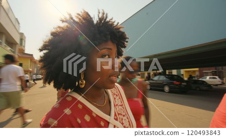 woman with a large, curly afro hairstyle 120493843