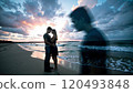 couple standing on a sandy beach 120493848