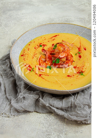 pumpkin cream soup with shrimp, herbs and spices, homemade, no people, 120494086