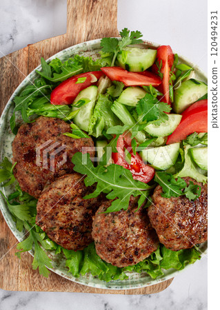 Fried cutlets, mixed minced meat, with vegetable salad, homemade, top view, no people, 120494231