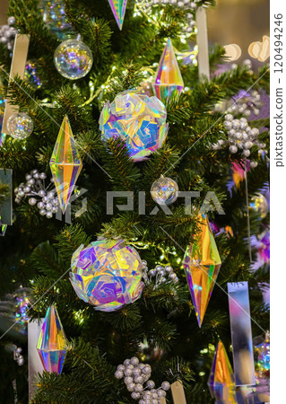 Christmas tree with decorations, balls, garlands. Abstract festive background for design. Winter holiday Christmas tree with decorations, balls, garlands. Abstract festive background for design. Winter holiday 120494246