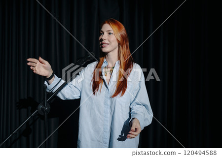 Engaging Woman Smiling During Public Speaking 120494588