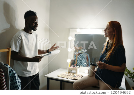 Discussing Presentation in Modern Dressing Room Discussing Presentation in Modern Dressing Room 120494692