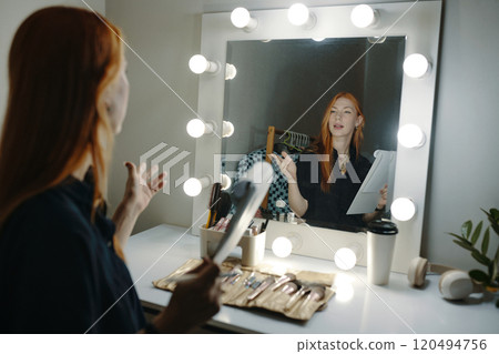 Person Discussing Skincare Routine in Front of Mirror Person Discussing Skincare Routine in Front of Mirror 120494756
