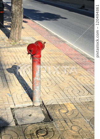 Red fire hydrant at sidewalk . Red fire hydrant at sidewalk . 120494861
