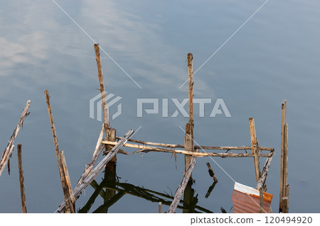 abandoned molder wooden house, Ruins of wood buildings near the shore of the lake. abandoned molder wooden house, Ruins of wood buildings near the shore of the lake. 120494920