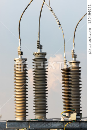 High voltage post, High voltage tower, show with high voltage construction and power lines. 120494921