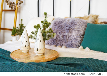 Ceramic decorative trees and soft textiles, throw pillows in a tranquil bedroom setting background Ceramic decorative trees and soft textiles, throw pillows in a tranquil bedroom setting background 120495039