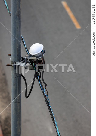 Photoelectric sensor switch Installed on an public electric pole, Automatic turn on and off by Sun light. use for electric lamps. 120495181