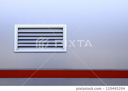 Air ventilator, metal slat frame on gray wall background. Air ventilator, metal slat frame on gray wall background. 120495204