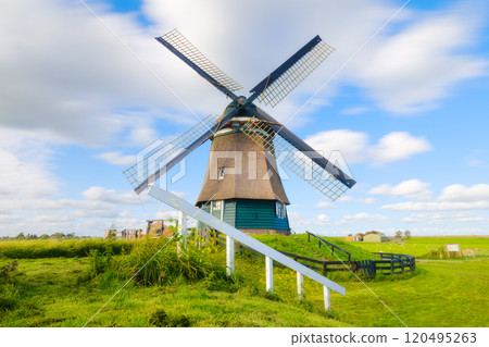 Landscape with windmill. Dutch. Agricultural fields and pastures. 120495263