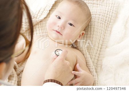 Asian baby being examined at the hospital Asian baby being examined at the hospital 120497346
