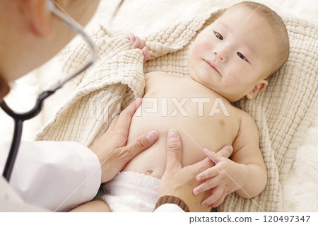 Asian baby being examined at the hospital Asian baby being examined at the hospital 120497347