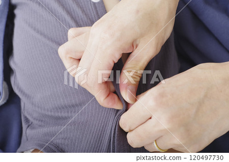 A mother checking her baby's diaper 120497730