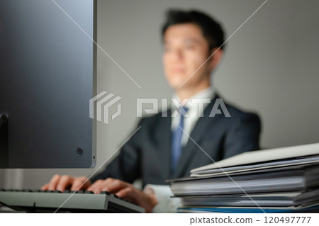 A businessman who works on a personal computer A businessman who works on a personal computer 120497777