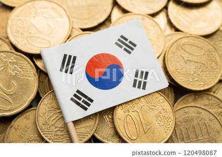 Korea flag on coin and banknote money, finance trading investment business currency concept. Korea flag on coin and banknote money, finance trading investment business currency concept. 120498087