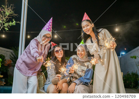 Celebrating with Friends, Sparklers, and Joyful Memories at a Festive Gathering 120498709