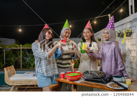 The Joyous Celebration of Friendship Women Having Fun at a Vibrant Party Together 120498844