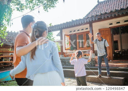 asian grandfather waving hand greeting granddaughter asian grandfather waving hand greeting granddaughter 120498847