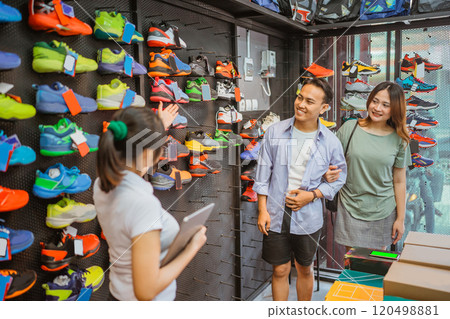 asian couple customer shopping athletic footwear asian couple customer shopping athletic footwear 120498881
