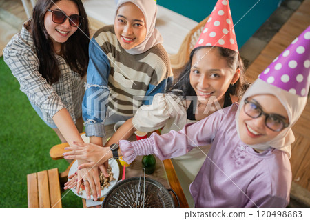 Celebration with Friends Enjoyable Moments and Festive Fun with Party Hats 120498883